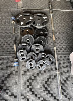 Olympic weights rubber coated 205lbs total plus curl bar and 7ft 40lbs bar