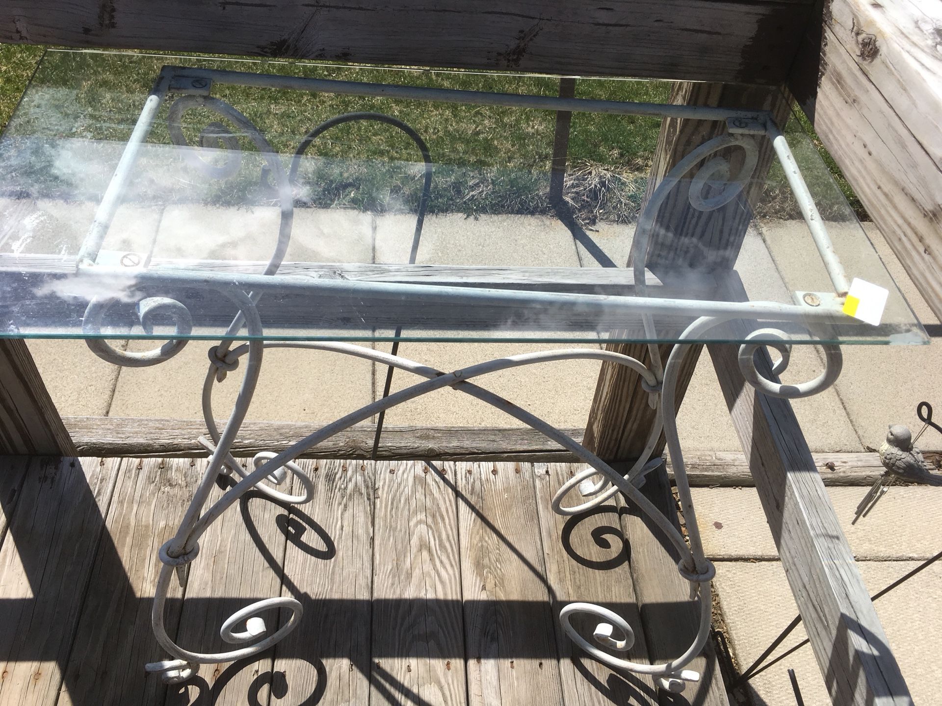 Wrought iron table console with glass top