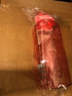 Wellness 1 gallon pink plastic jug