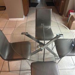 Glass Round Table And Silver Gray Chairs 4