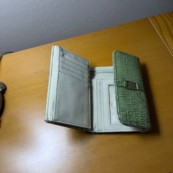 It’s A Beautiful little Wallet From NiNE WEST The Color Is Green It’s Barely Used 