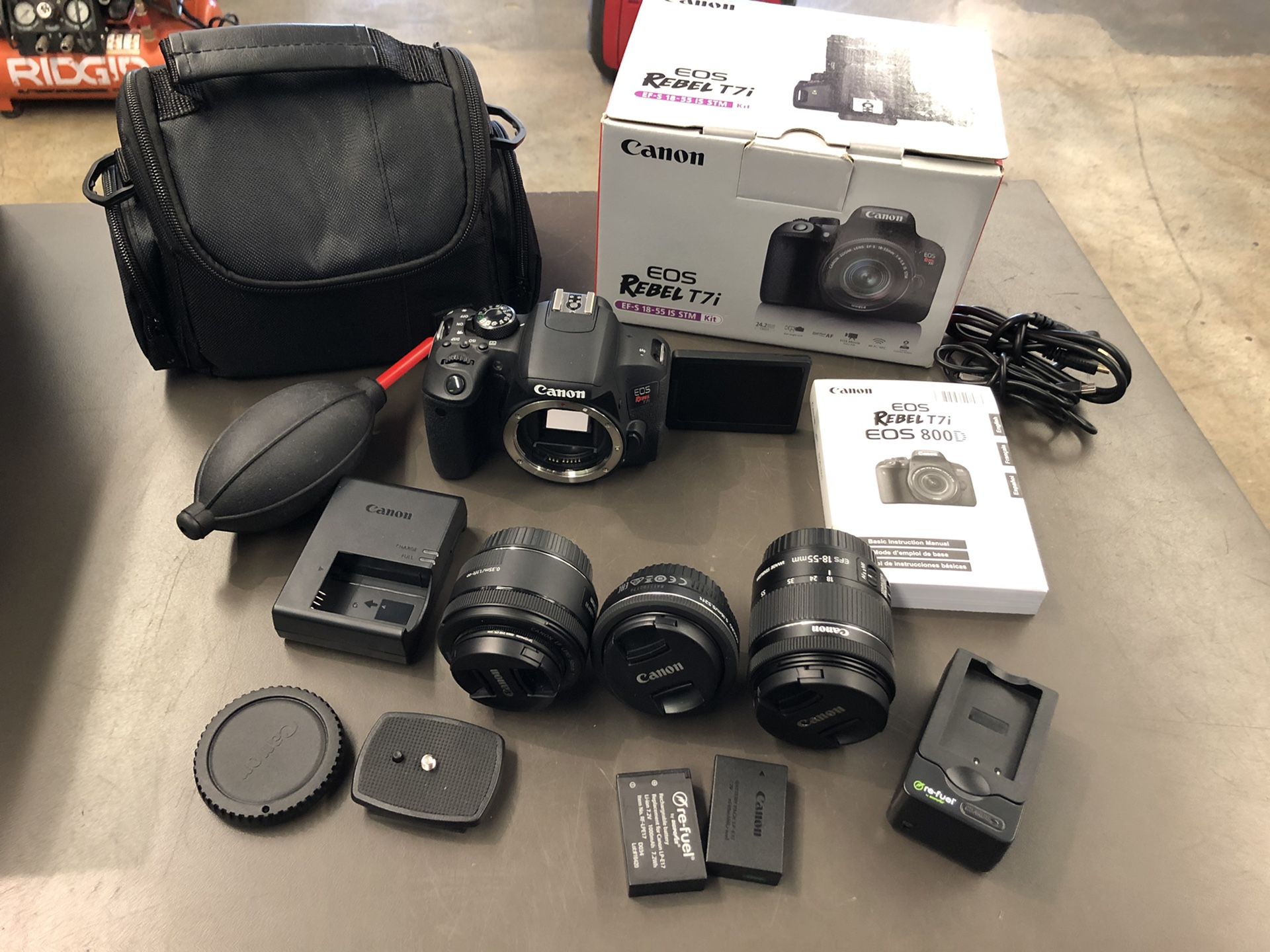 Canon EOS Rebel T7i with 3 lenses EFS 18-55mm, 50mm, EFS 25”4mm 2 chargers and batteries carrying case no trades pick up in Tacoma