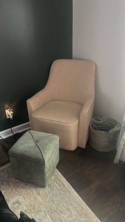 set of two light yellow swivel chairs with foot rest