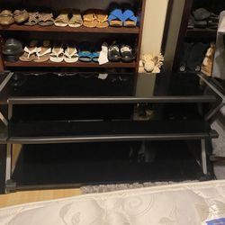 3 tier tempered glass entertainment center with child bumpers 