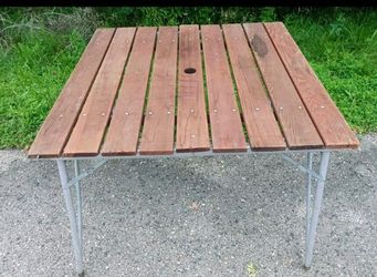 Wood top patio table with aluminum frame and umbrella hole