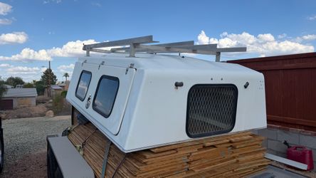 White Truck Camper Shell with Roof Rack