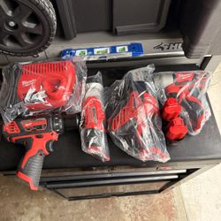 Milwaukee Drill, Impact Drill, Compact Light With Magnet, Reciprocating Saw, Two Batteries Charger And Tool Bag 