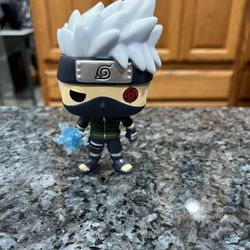 Vinyl Toy Funko Pop Animation: # 548 Naruto Shippuden - Kakashi with Lightning Blade Collectible Figure.  Preowned has been on display in a cabinet.  
