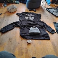 el Tapatio Shirt Black And White, XL Black Khakis, Large Long Sleeve Heavy Shirt Black, And Gray Beanie, And Beats Earbuds With 1 Earbud.