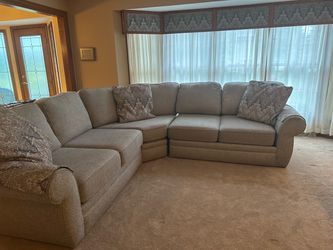 Large L-Shaped Sectional Sofa with Throw Pillows