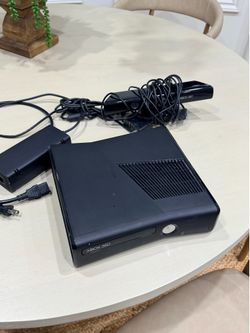 Xbox 360 console with Kinect and cables.