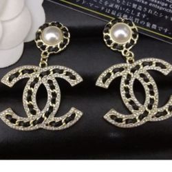 CC SILVER AND BLACK FAUX LEATHER EARRINGS