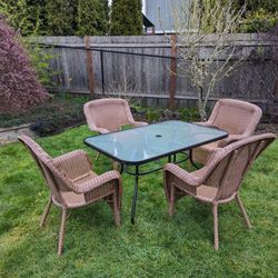 Outdoor Glass Patio Table And Wicker Chairs 