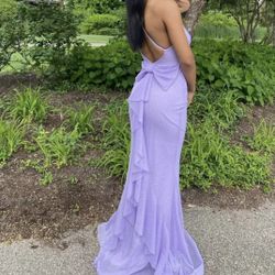 Lilac prom dress with ruffles and bow detail
