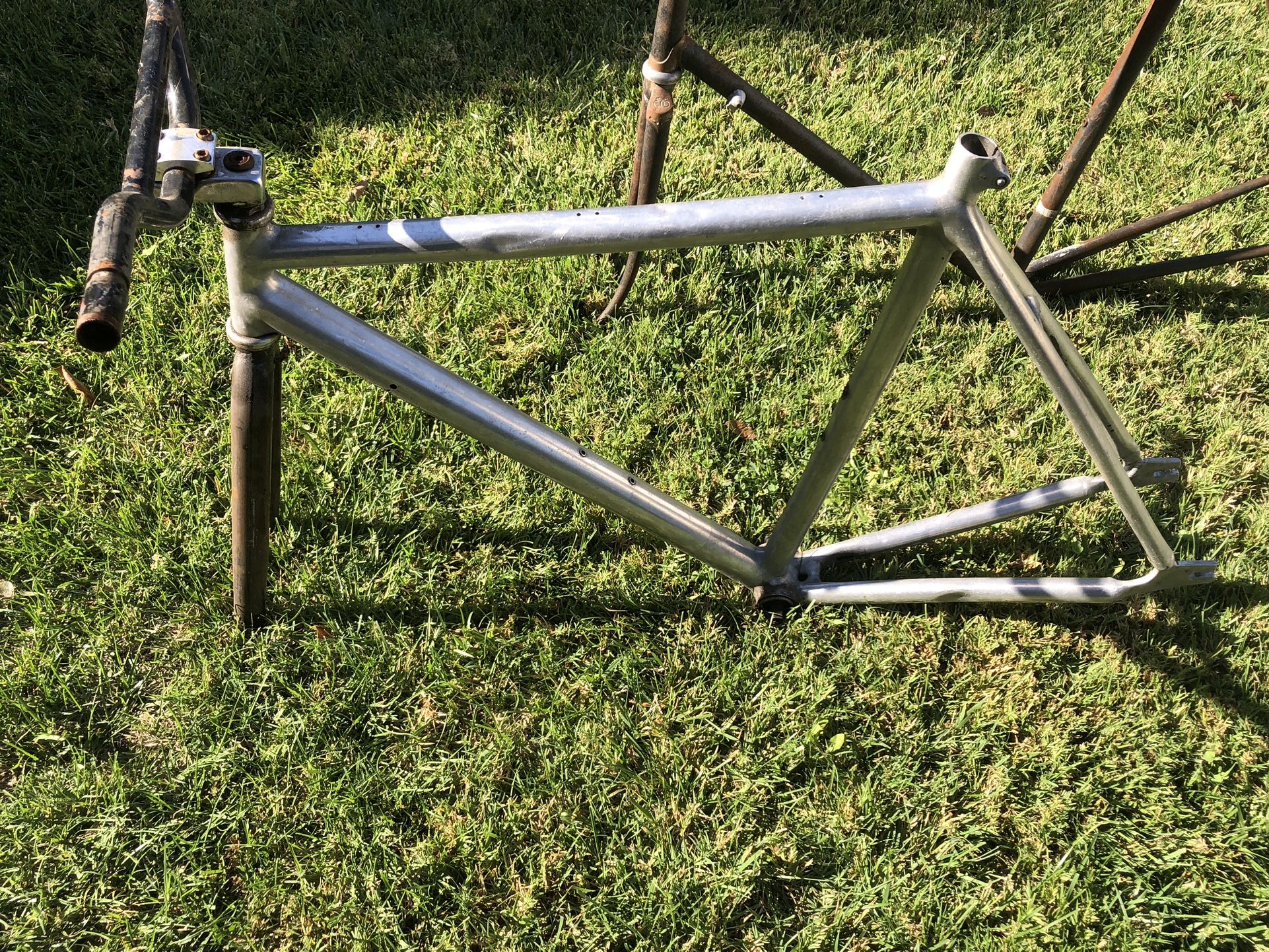 alum cannondale  conversion framew/campybb , eddie merx roadbike frame both about 56-58cm , velocity rims alum 700 , bullhorn& cut riser bars.  bars 