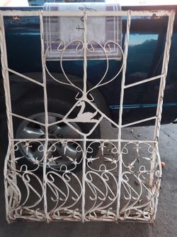 Absolutely stunning heavy iron Juliet balcony with Swan