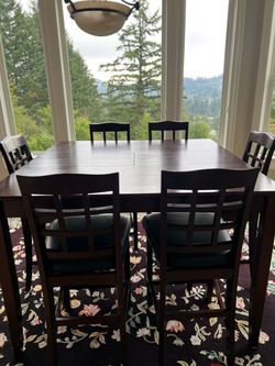 High top table with eight chairs