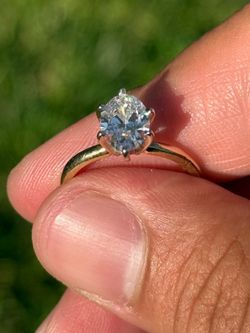 Woman's oval diamond engagement ring