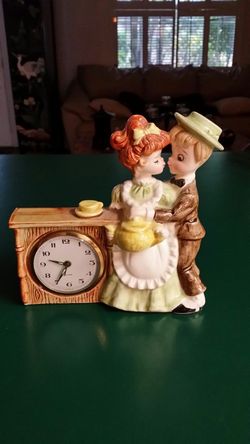 Vintage boy and girl clock