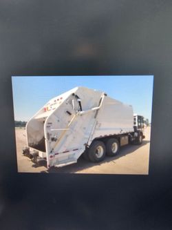 White Rear-Loader Garbage Truck