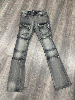 Grey washed distressed stacked jeans