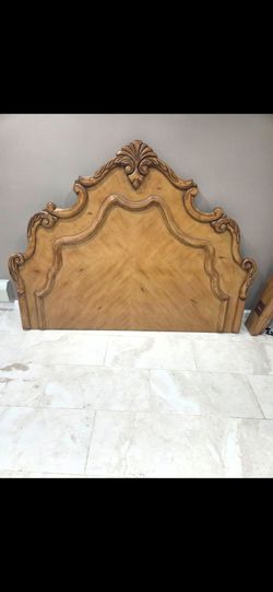 Headboard and decorative traditional wood-framed wall mirror