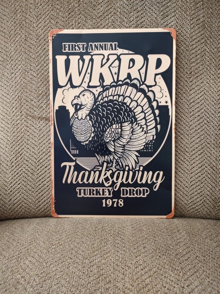 WKRP TURKEY DROP METAL SIGN (1978). 12" X 8". NEW. PICKUP ONLY.
