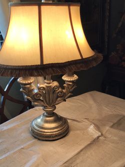 Antique gold lamp . Heavy in weight