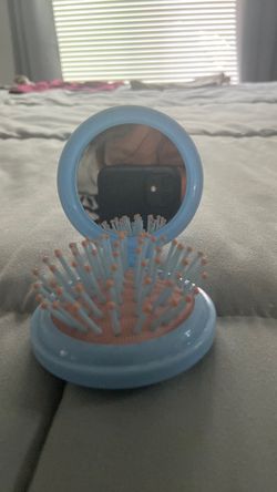 Mirror and hair comb