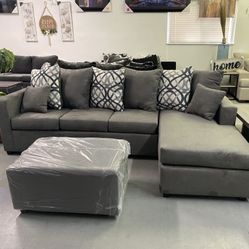 Grey Sectional With Designed Pillows 