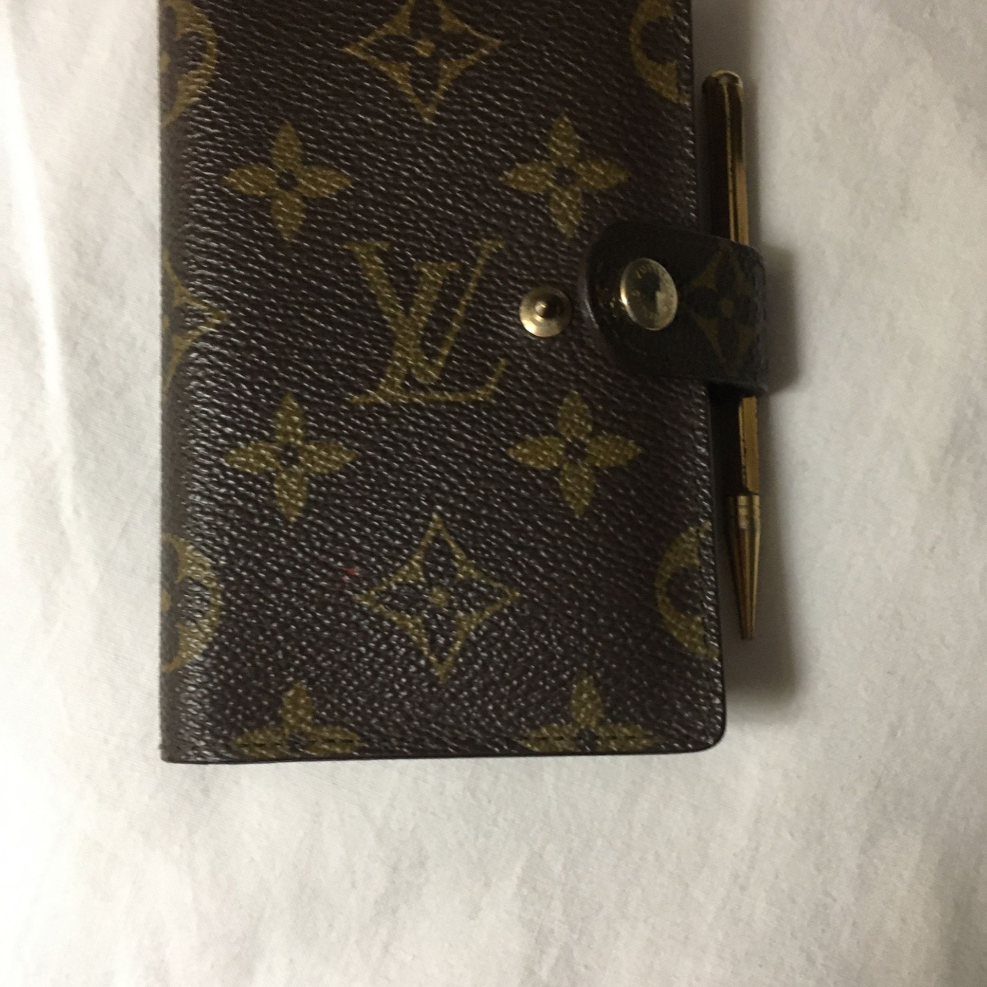 Vintage Louis Vuitton address book with pin you can buy refillable address in Calendar I have the receipt it was bought in 1991