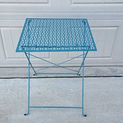 LOVELY AQUA/BLUE METAL FOLDING OUTDOOR SIDE TABLE with a Decorative Cutout Pattern.
