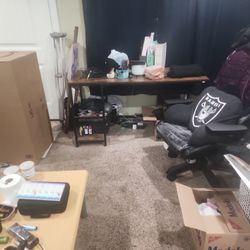 Moving Out Of My house. There's A Black Glass table,a Little Coffee Table, A Big Work Desk.  