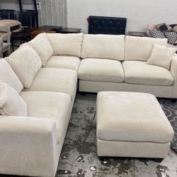 corduroy Sectional Sofa with Ottoman and 2 accent pillows.