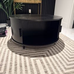 Black drum coffee table with 360 storage 