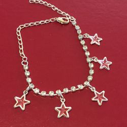 Cute pink star bracelet with 5 Pink stars and 23 shiny stones. 7.5 " but expands to 9" long