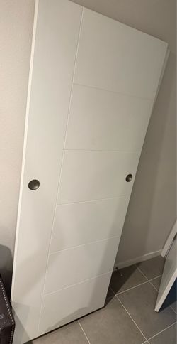 Modern white pair of sliding closet doors