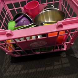 Pink basket with kitchen essentials