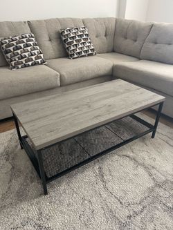 Coffee table with mesh shelf