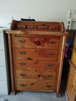 Solid wood chest of drawers, hand carved. $350