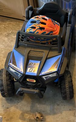 Boys motorized car with helmet