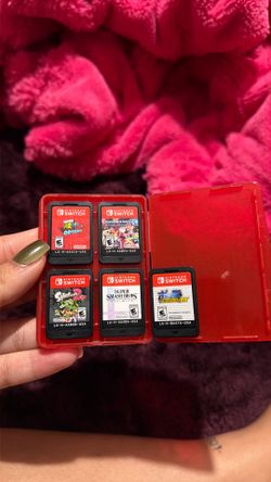 Nintendo switch mario oddyssey, mario kart deluxe 8 , splatoon 2, super smash bros and tokken torunament