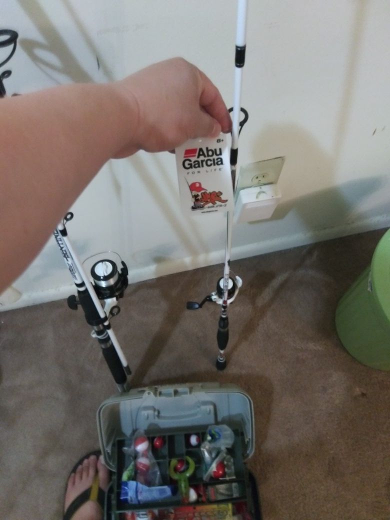 Fishing rod and tackle box full of hooks,weights and lures