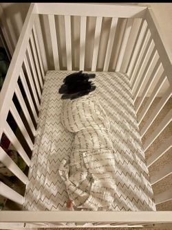 White crib with mattress