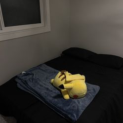 Queen size bed for sale with two pillows and bed frame