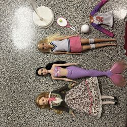3 Barbie dolls with extras