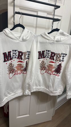 Matching Christmas sweaters for couples, worn once; sizes L and M.