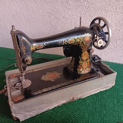Antique Singer Sewing Machine fitted with working electric motor with footpedal.