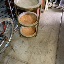 Three tiered brass table