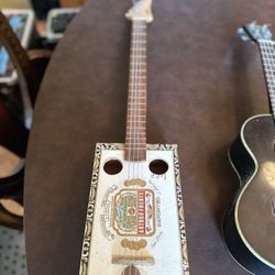 Cigar box guitar and Ukulele with case. 